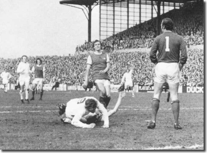 Mick Jones is laid low, but he has just put United 2-0 up against Arsenal