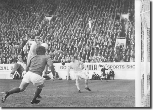 Despite an attempted clearance by Birmingham's Tommy Carroll Mick Jones forces home a third goal for Leeds