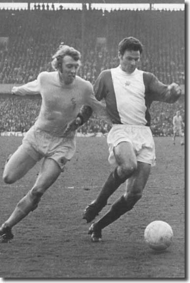 Mick Jones challenges Roger Hynd for the ball