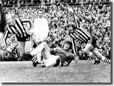 Newcastle's John Tudor has just headed past David Harvey to put his side 2-1 ahead with Malcolm Macdonald joining in the celebration