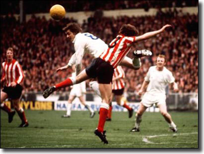 Allan Clarke challenges Sunderland's Ron Guthrie for a header