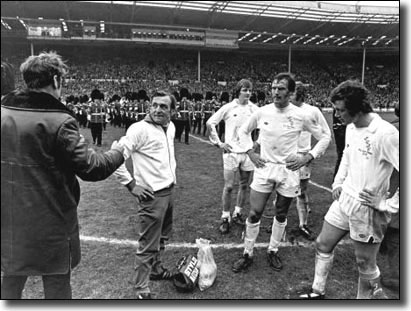 Leeds United manager Don Revie tries to console trainer Les Cocker and players Allan Clarke, Paul Madeley, Mick Jones and Trevor Cherry after their shock 1-0 defeat to Sunderland