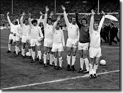 The Leeds United team wave to the crowd before the match: Billy Bremner, David Harvey, Paul Reaney, Johnny Giles, Norman Hunter, Trevor Cherry, Peter Lorimer, Eddie Gray, Paul Madeley, Mick Jones, Terry Yorath, Allan Clarke