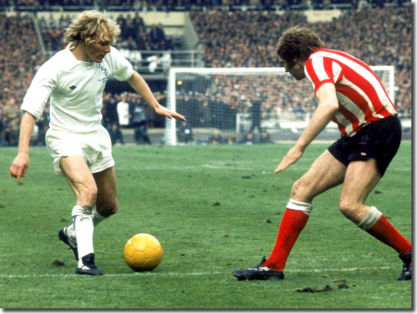 Terry Yorath takes on Ron Guthrie