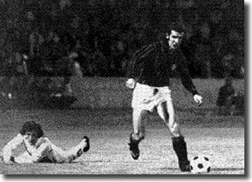 Cherry looks on forlornly as his slip allows Albertino Bigon to attack the United goal, but David Harvey saved his effort