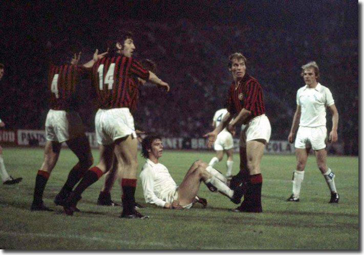 Italian defenders protest after an aerial challenge from Joe Jordan - the United striker was booked