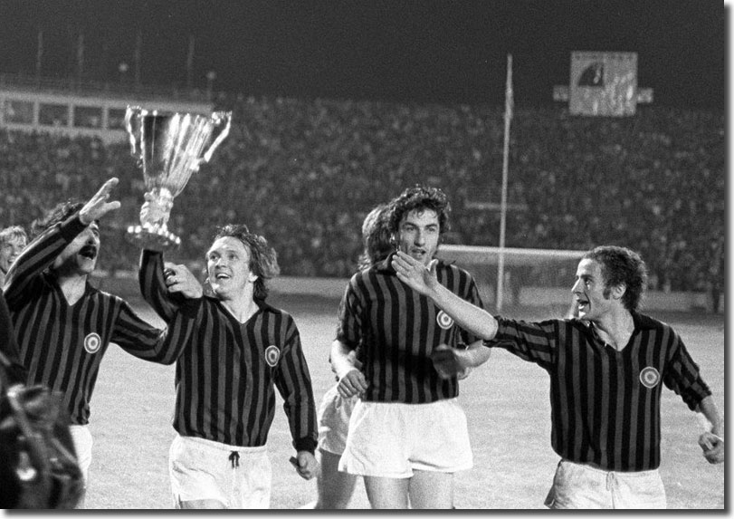 Milan players Turone, Sogliano, Anquilletti and Chiarugi joyously parade the trophy at the end but United will never accept that their success was anything other than a travesty of justice