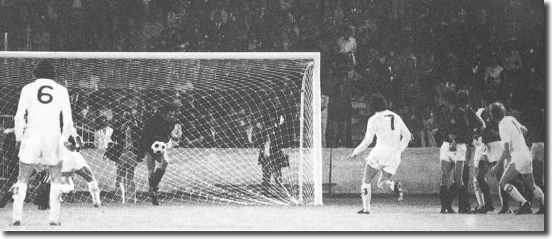 Milan keeper William Vecchi gathers a United shot as Lorimer and Yorath look to follow in