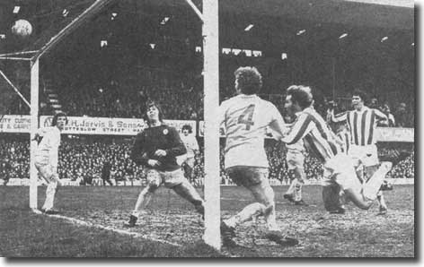 City captain Denis Smith comes crashing in to head Stoke into the lead