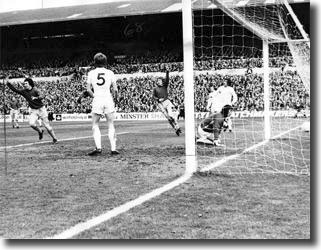 Paul Fletcher wheels away from adevastated McQueen, Harvey and Hunter after opening the scoring at Elland Road