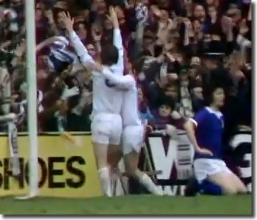 Ipswich's George Burley looks on on dismay as Allan Clarke and Peter Lorimer celebrate the England striker's winning goal