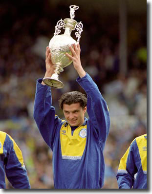 Speed lifts the League championship trophy after United's title triumph in 1992