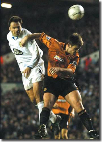 Mark Viduka in action against Wolves' Paul Butler at Molineux during the 4-1 triumph in February 2004