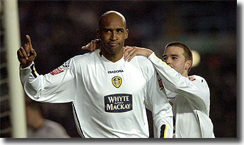 Brian Deane acknowledges the Elland Road crowd after scoring against QPR