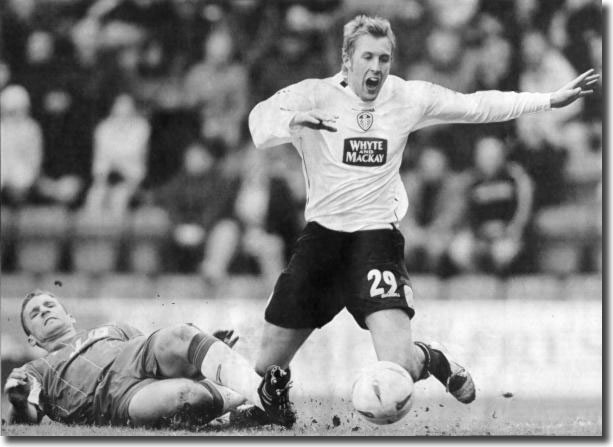 Wigan defender Matt Jackson brings down Rob Hulse in full cry during a 3-0 defeat at the JJB in February 2005