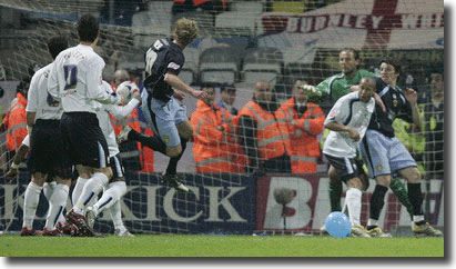 Rob Hulse opens the scoring for Leeds after heading home from a corner