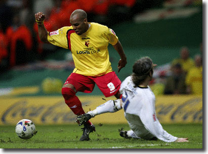 Shaun Derry fouls Watford's Marlon King to concede a penalty