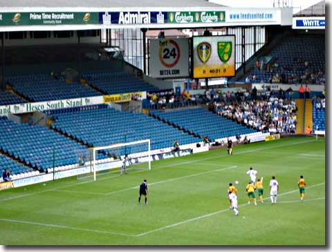 David Healy steps up before a deserted stand to convert his penalty against Norwich to win the season's opener