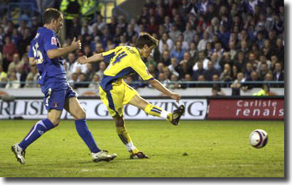 Jonny Howson scores the decisive second goal at Carlisle