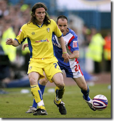 Carlisle's David Raven moves in to challenge David Prutton