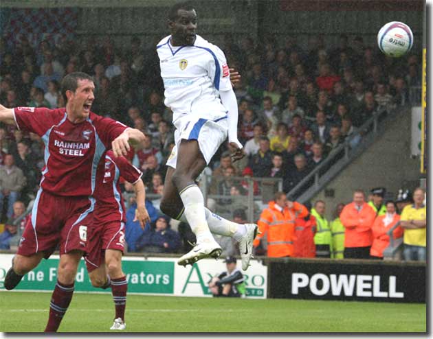 Debutant Enoch Showunmi heads in an equaliser at Scunthorpe on the opening day