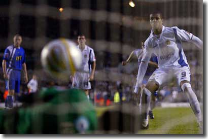 Jermaine Beckford can only look on in horror as Millwall's David Forde saves his penalty in the second leg at Elland Road