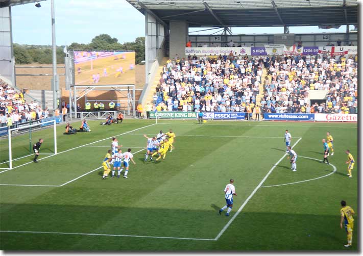 Jermaine Beckford challenges for a corner at Colchester