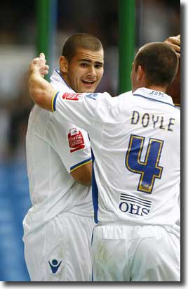 Michael Doyle congratulates Bradley Johnson on his second goal against Gillingham