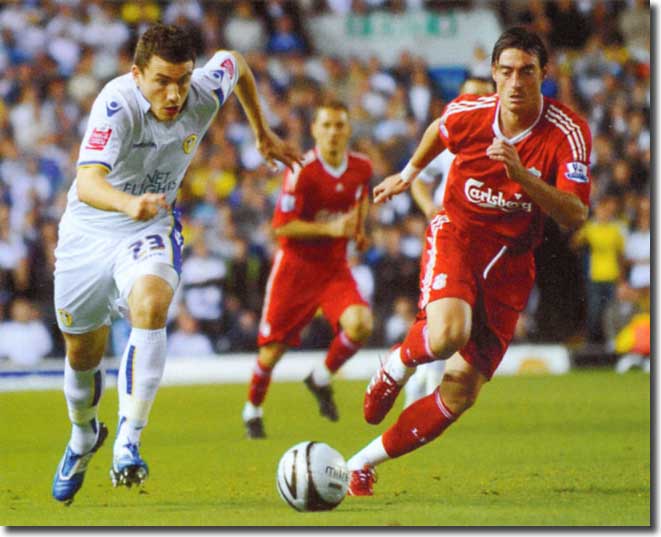 Rob Snodgrass chases for the ball with Liverpool's Albert Riera - the Scottish wide man had a wonderful night, pulling the Reds' defence apart