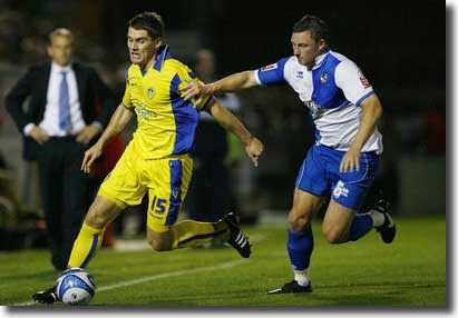 Sam Vokes takes on Bristol Rovers' Steve Elliott