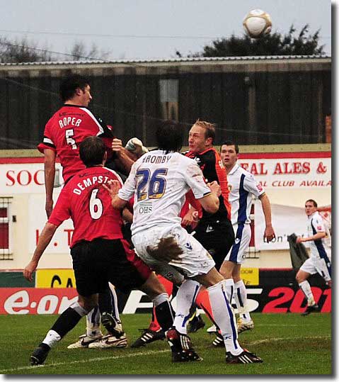 Ian Roper nods Kettering into the lead against Leeds at Rockingham Road