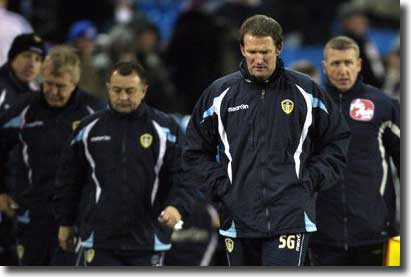 Simon Grayson leads off the United party after defeat at Elland Road in the first leg of the Johnstones Paint Trophy Northern Area final