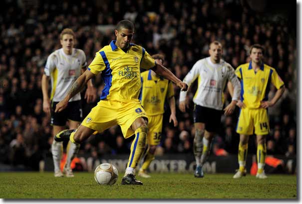 Jermaine Beckford scores from the penalty spot to level the scores 2-2 deep into injury time