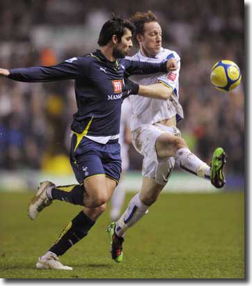 Luciano Becchio battles it out with Tottenham's Vedran Corluka