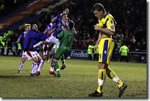 Shane Lowry has just missed a vital penalty at Carlisle in the Johnstones Paint Trophy final and the Cumbrians players start celebrating - seconds later the Leeds full-back was swamped by Carlisle fans