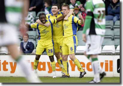 Richard Naylor celebrates opening the scoring at Yeovil on 5 April with Max Gradel and Robert Snodgrass - the game was a turning point for United