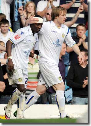 Max Gradel celebrates with Luciano Becchio after scoring the first goal against Southend on 10 April