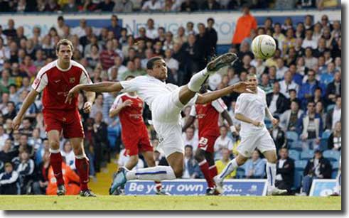 Jermaine Beckford acrobatically snatches United's third against MK Dons