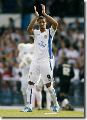 Jermaine Beckford acknowledges the fans after the defeat of MK Dons