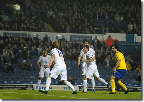 Easy as that! Unmarked Whites centre-back Alex Bruce nods United into the lead