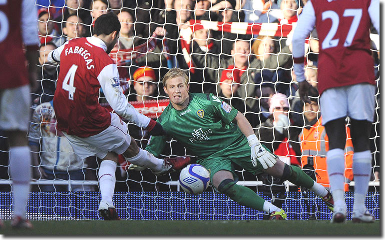 Cesc Fabregas fires his penalty down the middle as Kasper Schmeichel dives for his corner