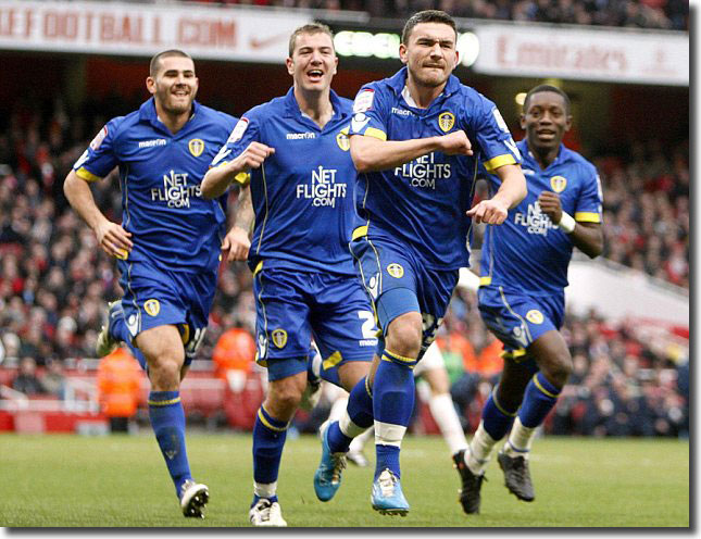 Johnson, Connolly and Gradel race to get in on the act as Robert Snodgrass celebrates opening the scoring at the Emirates