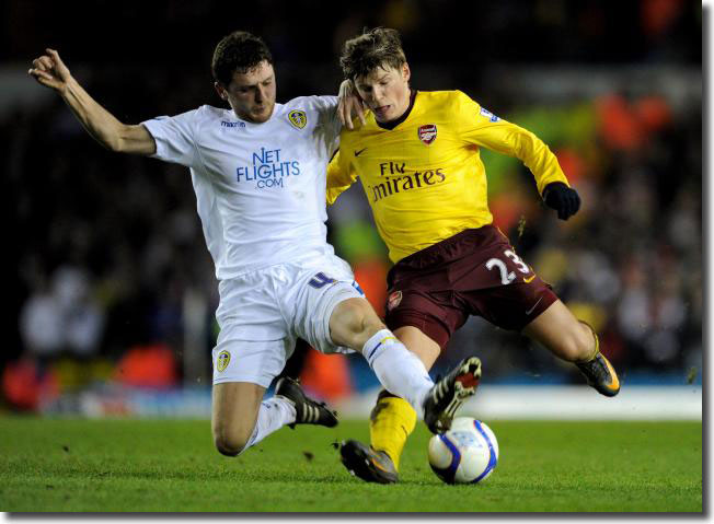 Alex Bruce crashes in to dispossess Andrey Arshavin
