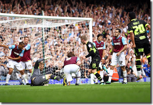 Adam Clayton celebrates his late equaliser at West Ham