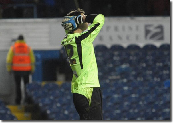 Rachubka holds his head after Coventry's Richard Wood equalises in injury time