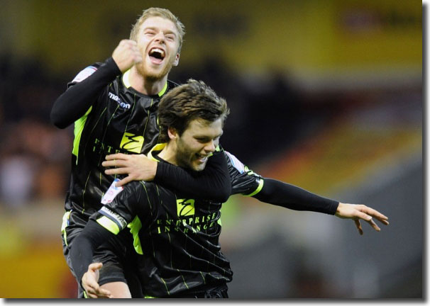 Adam Clayton gets in on the act as skipper Jonny Howson celebrates his goa