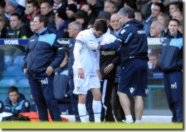 Jonny Howson limps out of the game against Millwall on 3 December - it turned out to be his final appearance for United before he was sold to Norwich