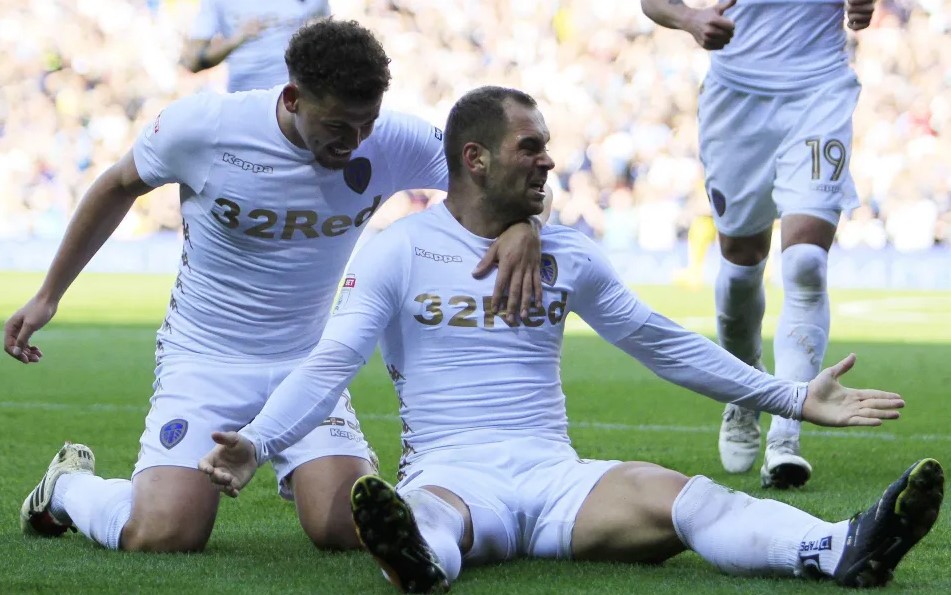 Kalvin Phillips congratulates Pierre-Micel Lasogga during his goalscoring debut against Burton United