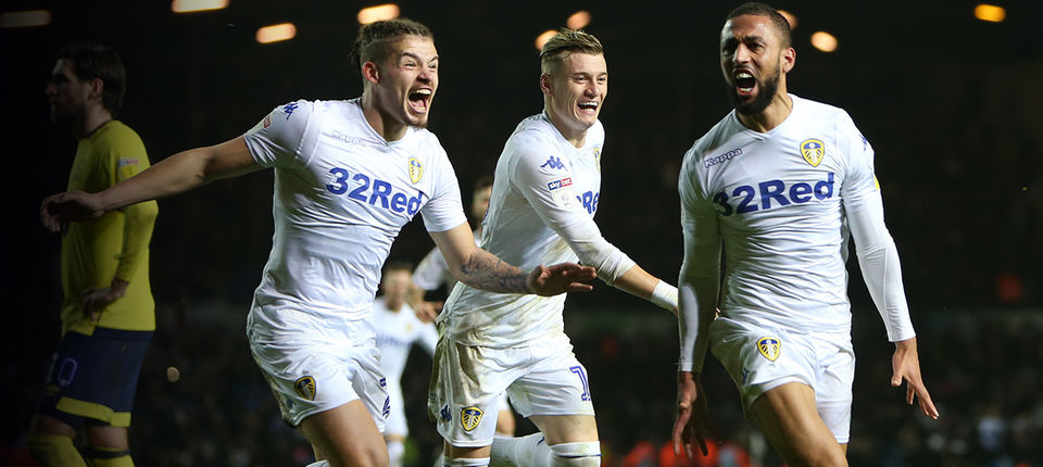 Kemar Roofe celebrates his dramatic winner against Blackburn with Kalvin Phillips and Gjanni Alioski