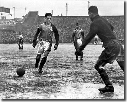 Charles ensures goalkeeper Harry Searson takes the ball in the Cup against Bolton in 1950